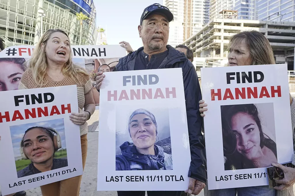 Larie Pidgeon (left) with Hannah Kobayashi's father, Ryan, on Nov. 21 in Los Angeles. Credit: AP Photo/Damian Dovarganes, File